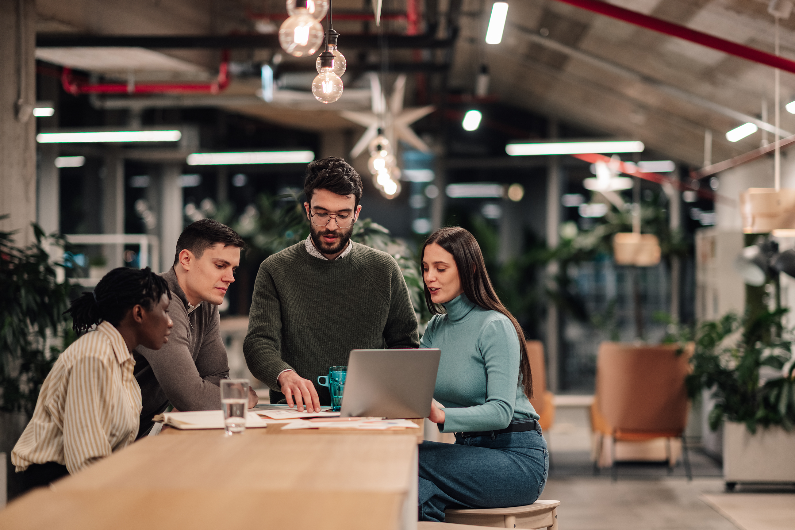 Employees looking at a laptop and how employment law changes are going to affect them.
